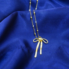 Gold Flowing Ribbon Bow Pendant For Women & Girls.