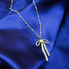 Gold Flowing Ribbon Bow Pendant For Women & Girls.